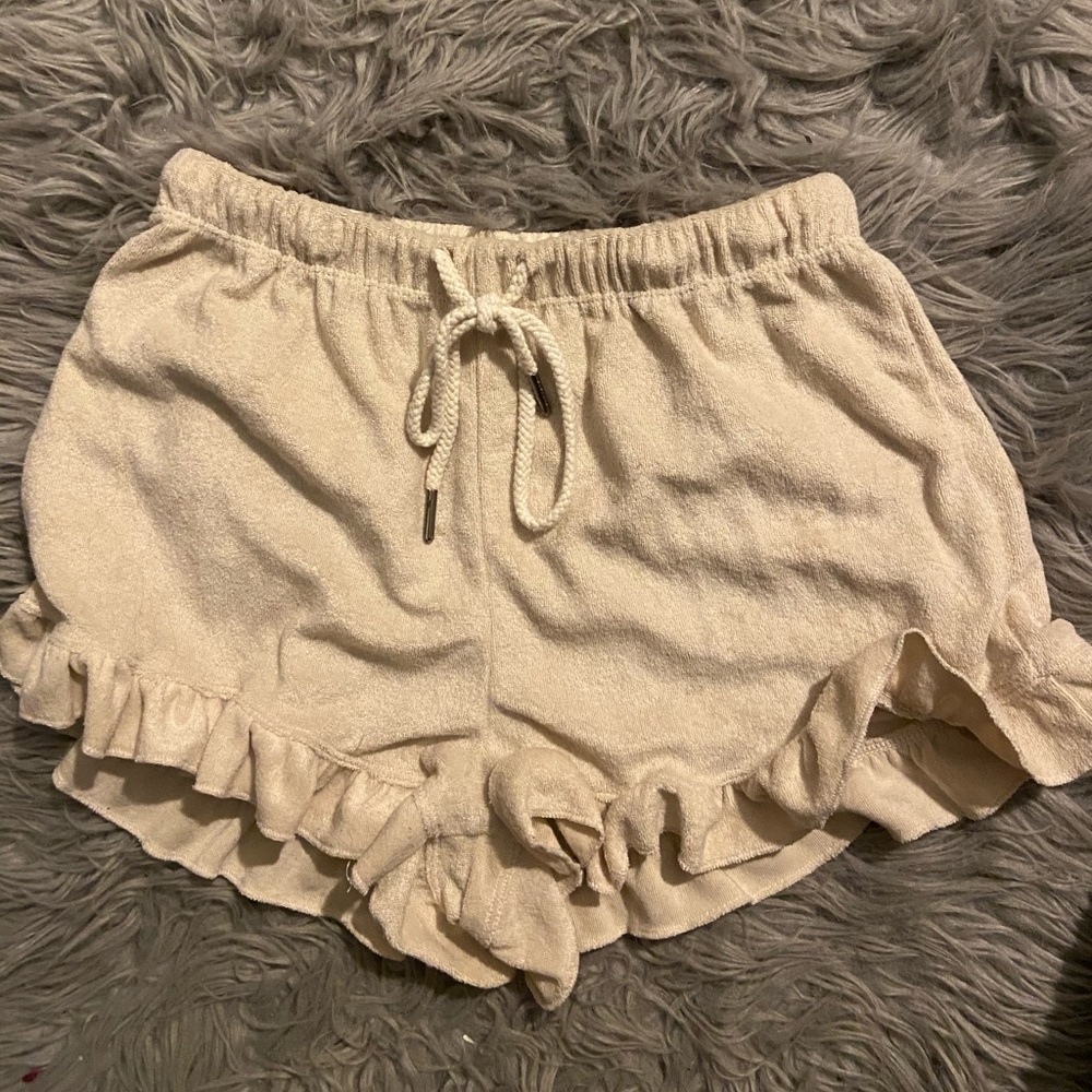 Tan Shorts with ruffled bottoms and drawstring